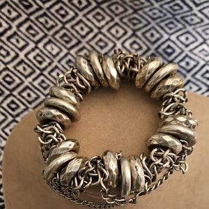 Elegant Silver Wuth A Hint Of Gold-Toned Bracelet